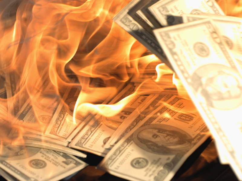 dollar bills burning